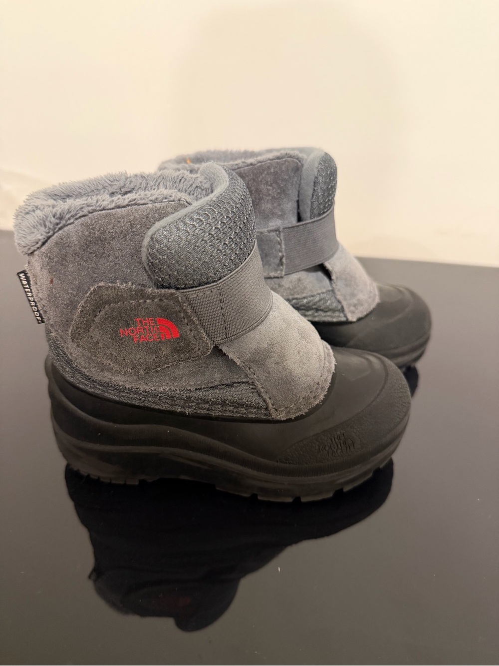 The North Face Kids' Grey and Black Waterproof Snow Boots with Red Logo